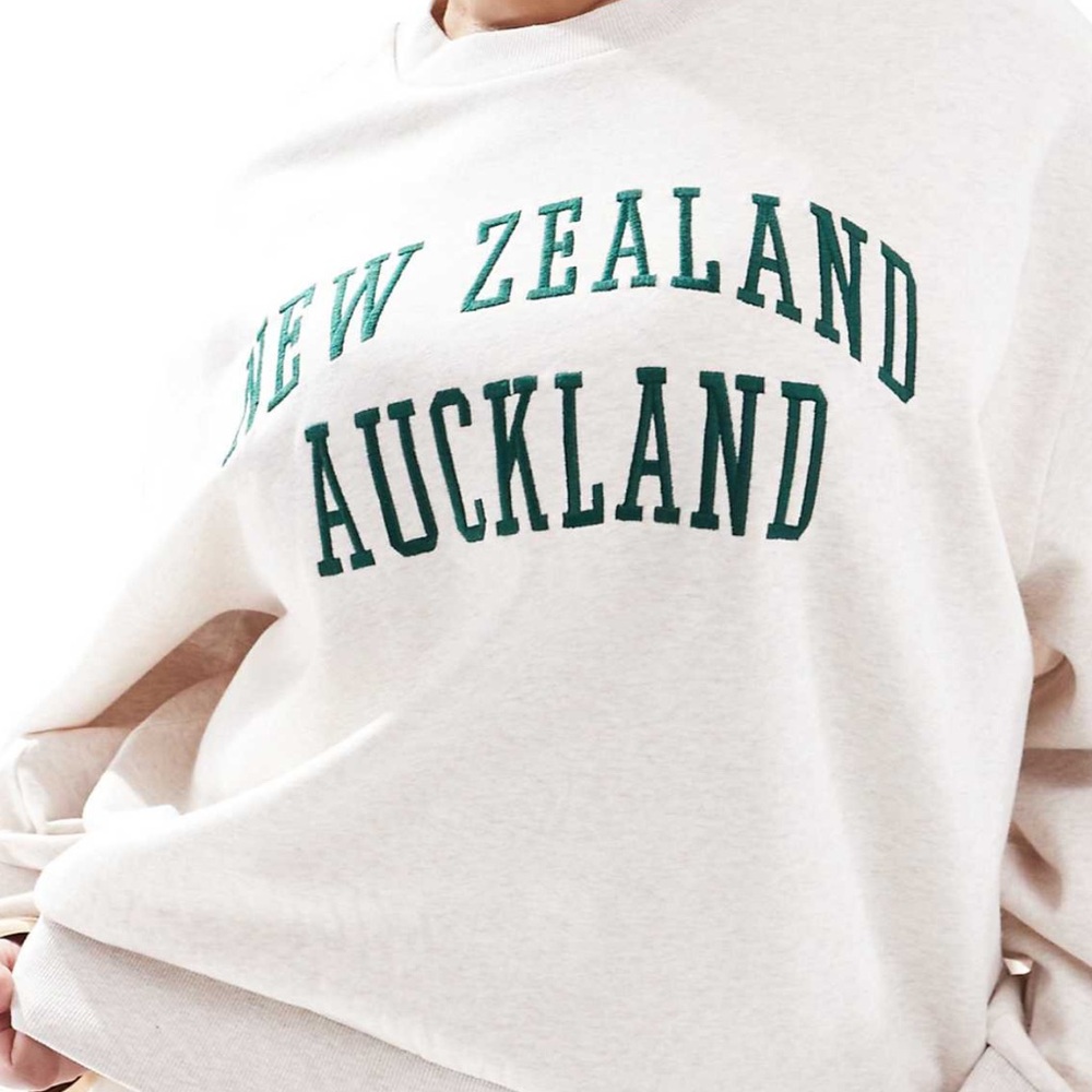 Cream Sweatshirt with Green Lettering